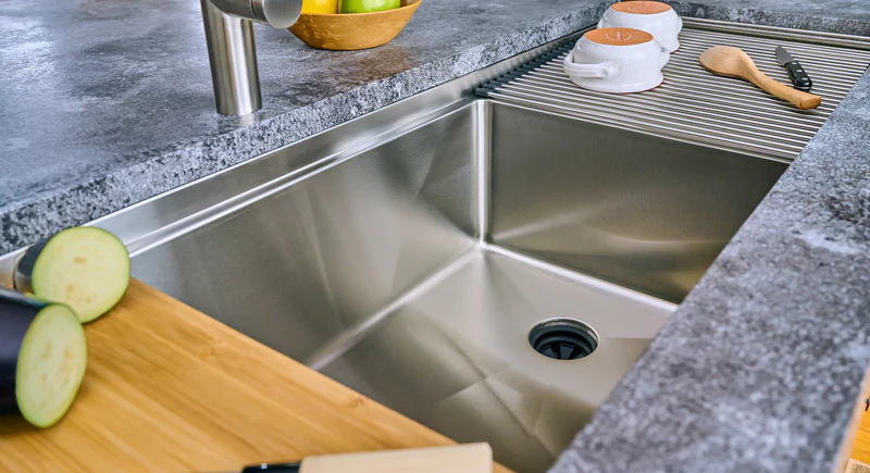 Granite composite kitchen sink installed with stone countertops
