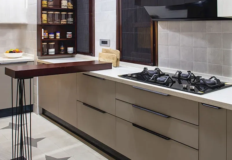 Kitchen using mixed countertop materials on the island and perimeter