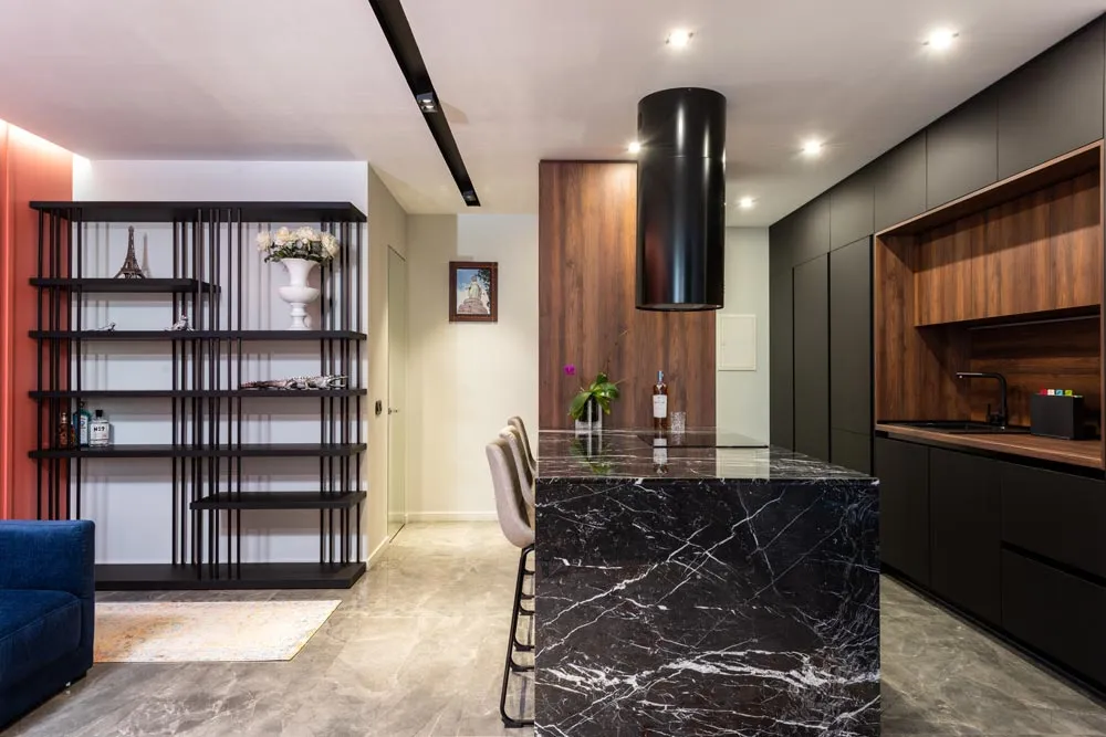 Stone Waterfall Kitchen Island Dark veined stone waterfall island in a modern kitchen