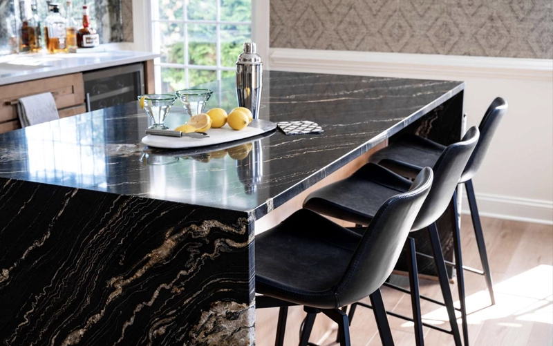Builder countertop material selection for a custom residential kitchen using coordinated stone surfaces