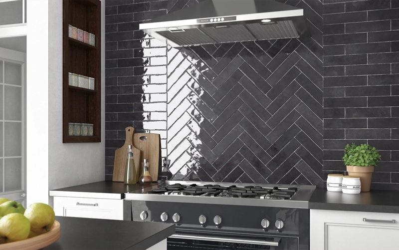 Large-format slab backsplash installed as a full-height kitchen wall panel