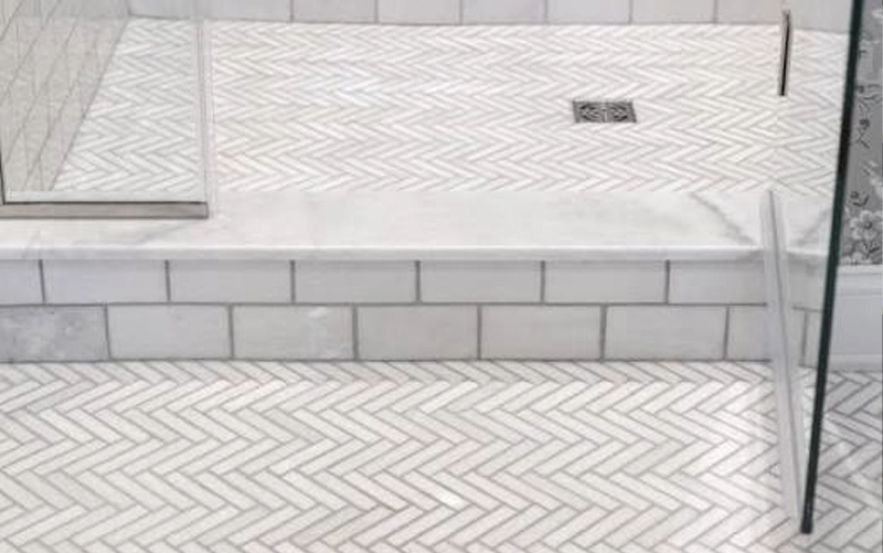 Completed custom stone shower jamb and threshold installation in Toronto