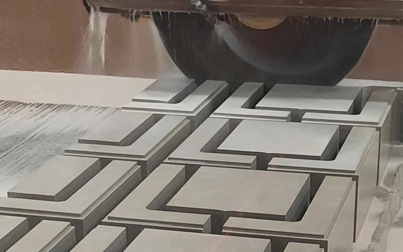 Custom stone fabrication workshop preparing slabs for cutting and finishing