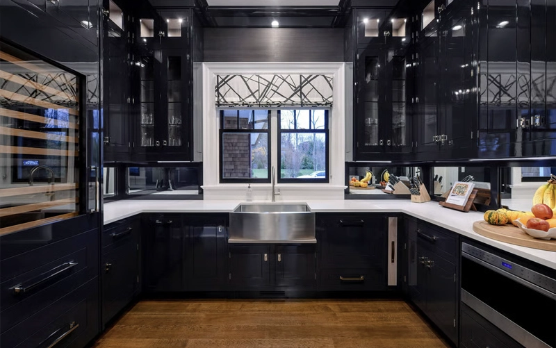 White quartz countertop paired with matte black kitchen cabinets