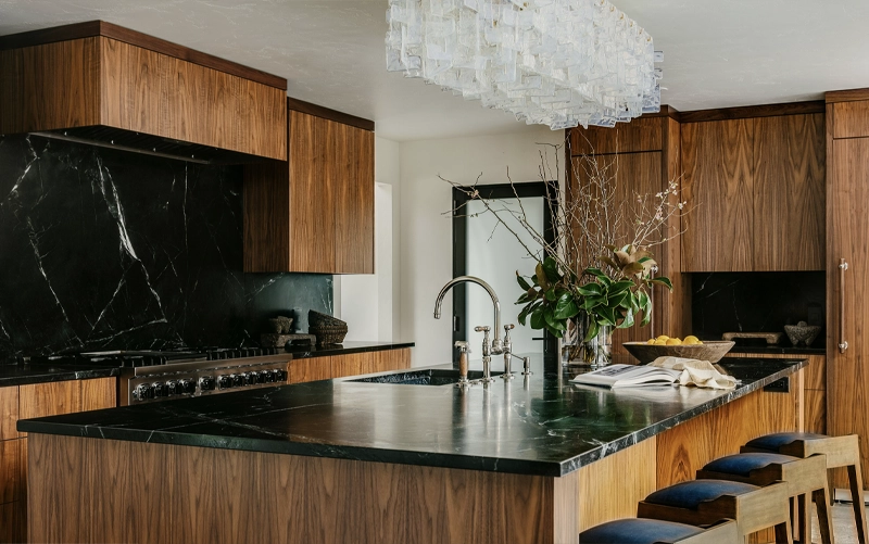 Light quartz countertop paired with natural wood kitchen cabinets